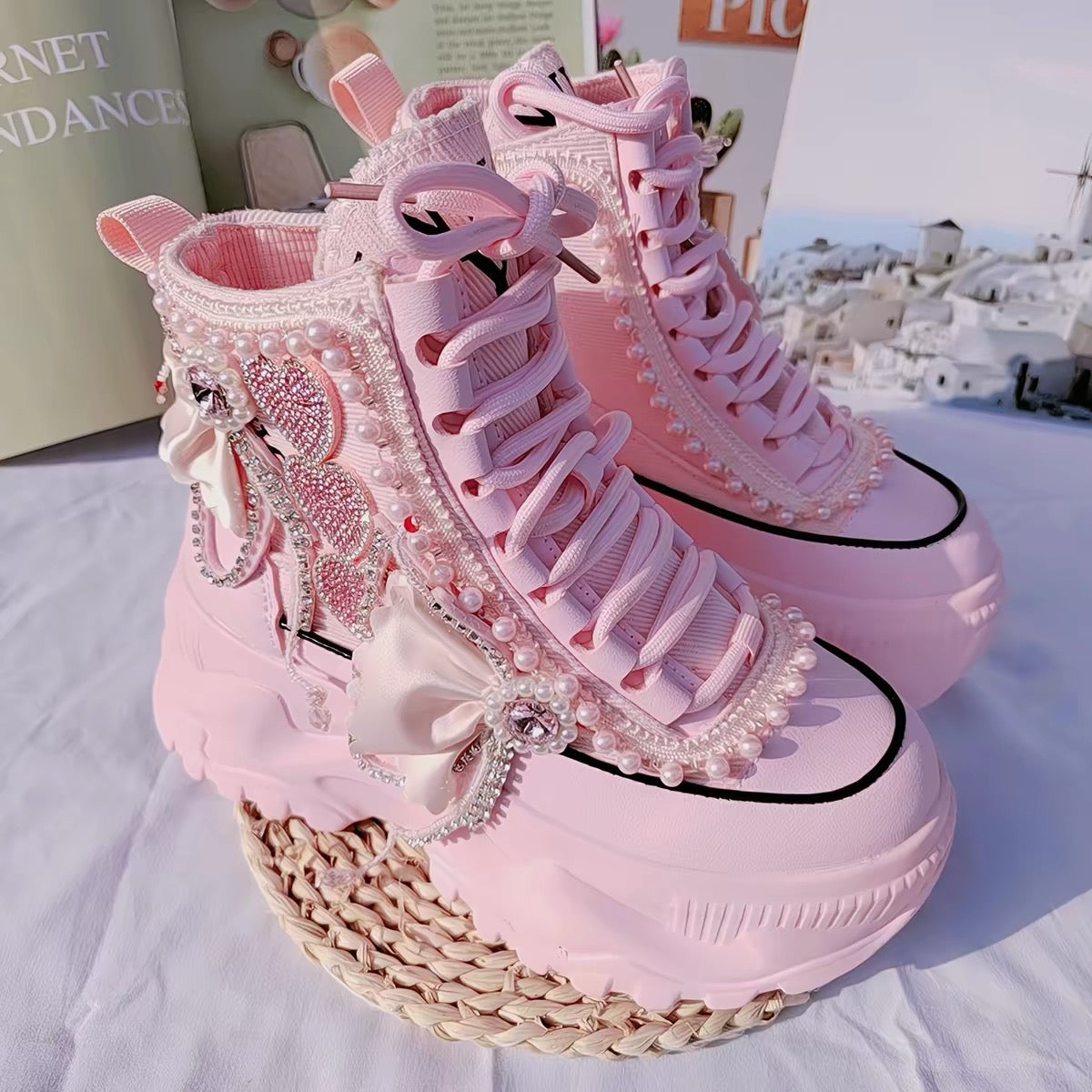 Pink pearl embellished platform sneakers front view