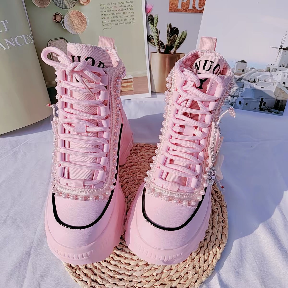 Pink pearl embellished platform sneakers front angle