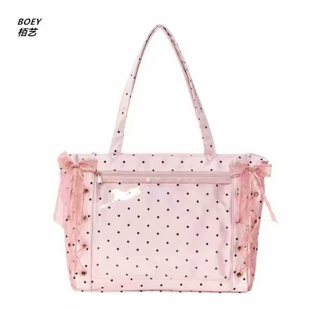 Pink polka dot ita bag with clear display pocket and lace-up ribbon sides
