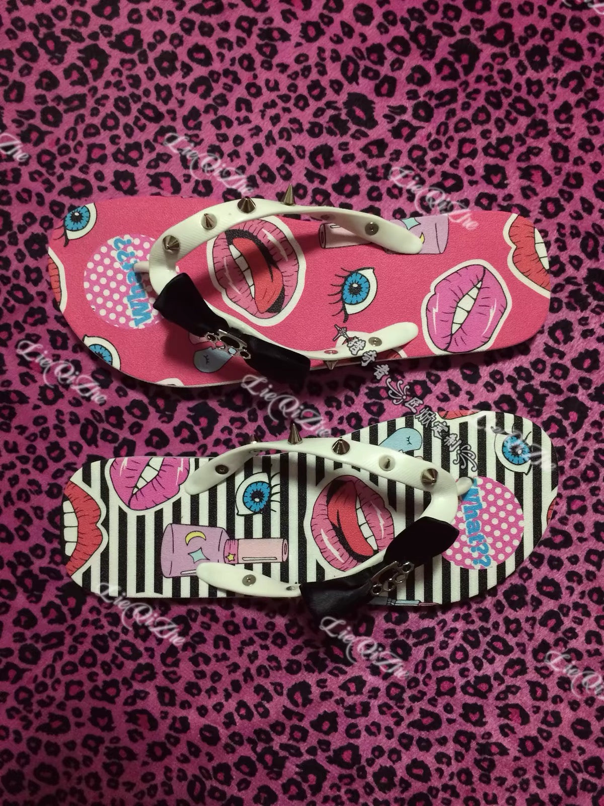 Pink and striped graphic flip-flops with bow accents