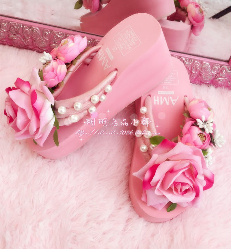 Pink rose platform sandals on pink faux fur background