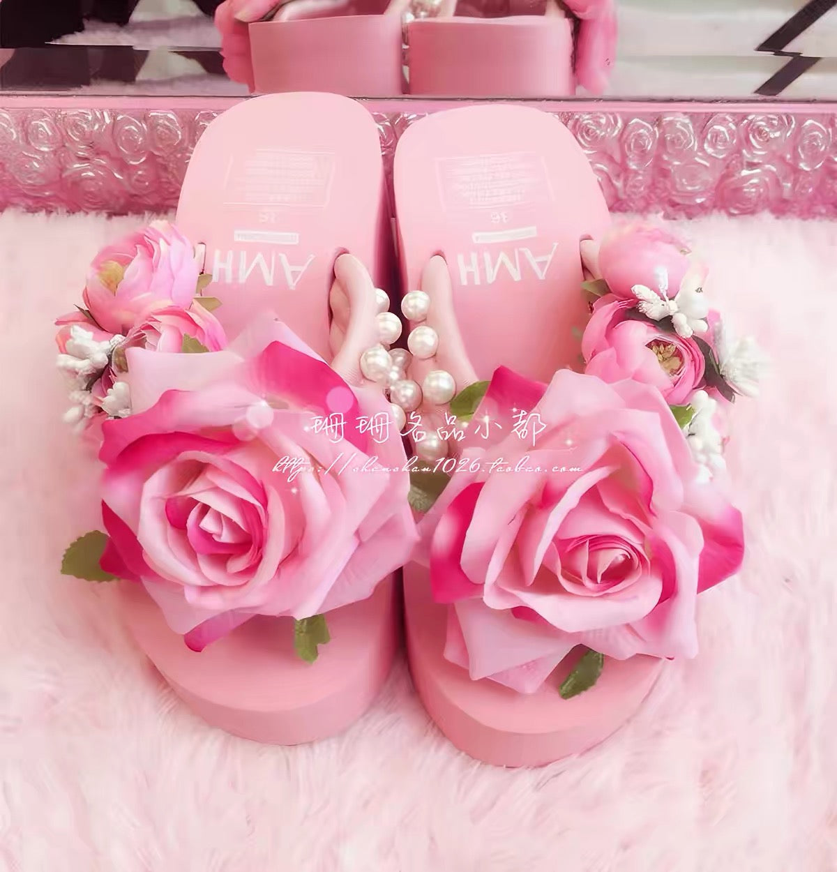 Front view of pink rose platform sandals with floral and pearl embellishments