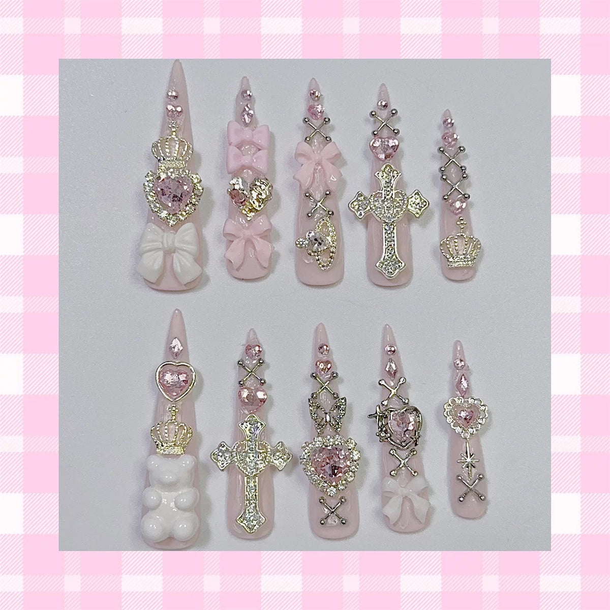 Pink press-on nail set displayed on pink gingham background