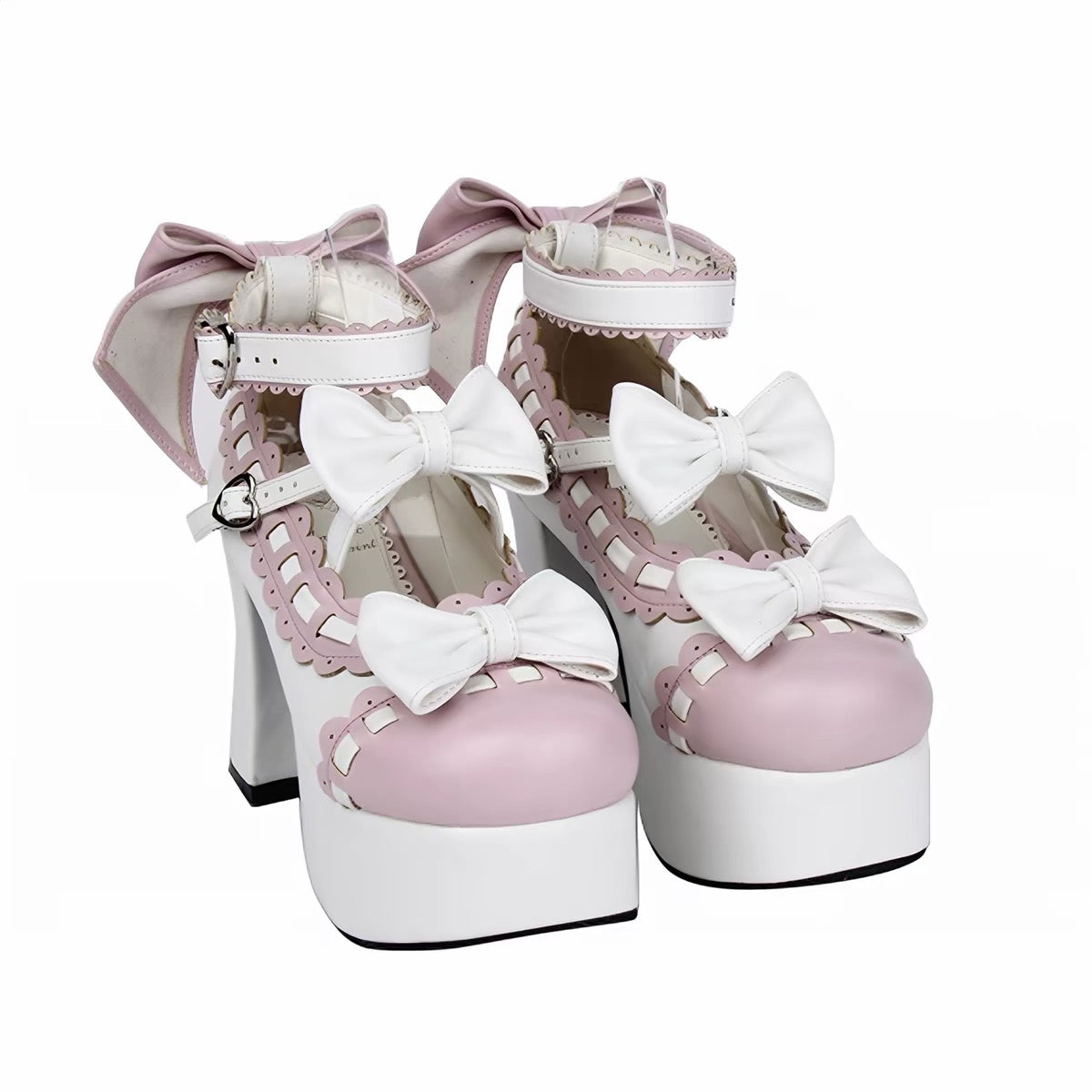 Pink and white platform heels with bow details, front angled view