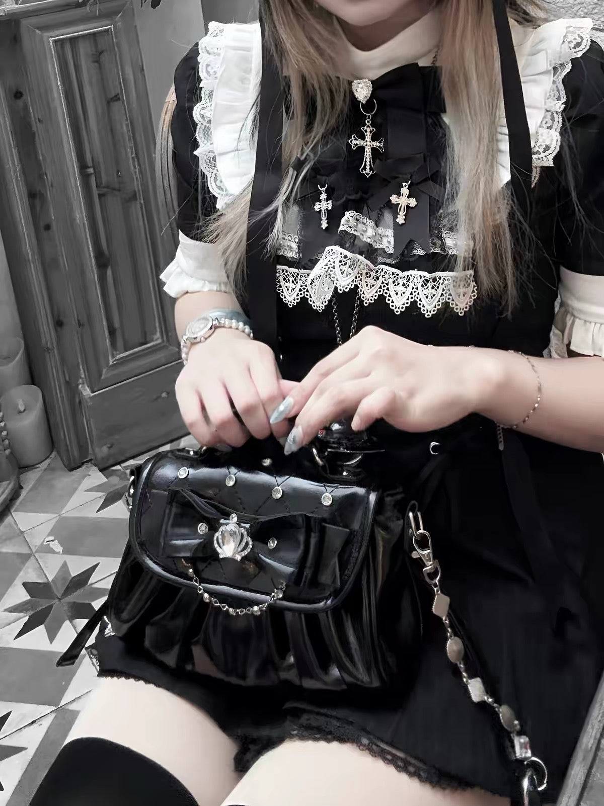 Black bow rhinestone handbag styled with a black and white lace outfit