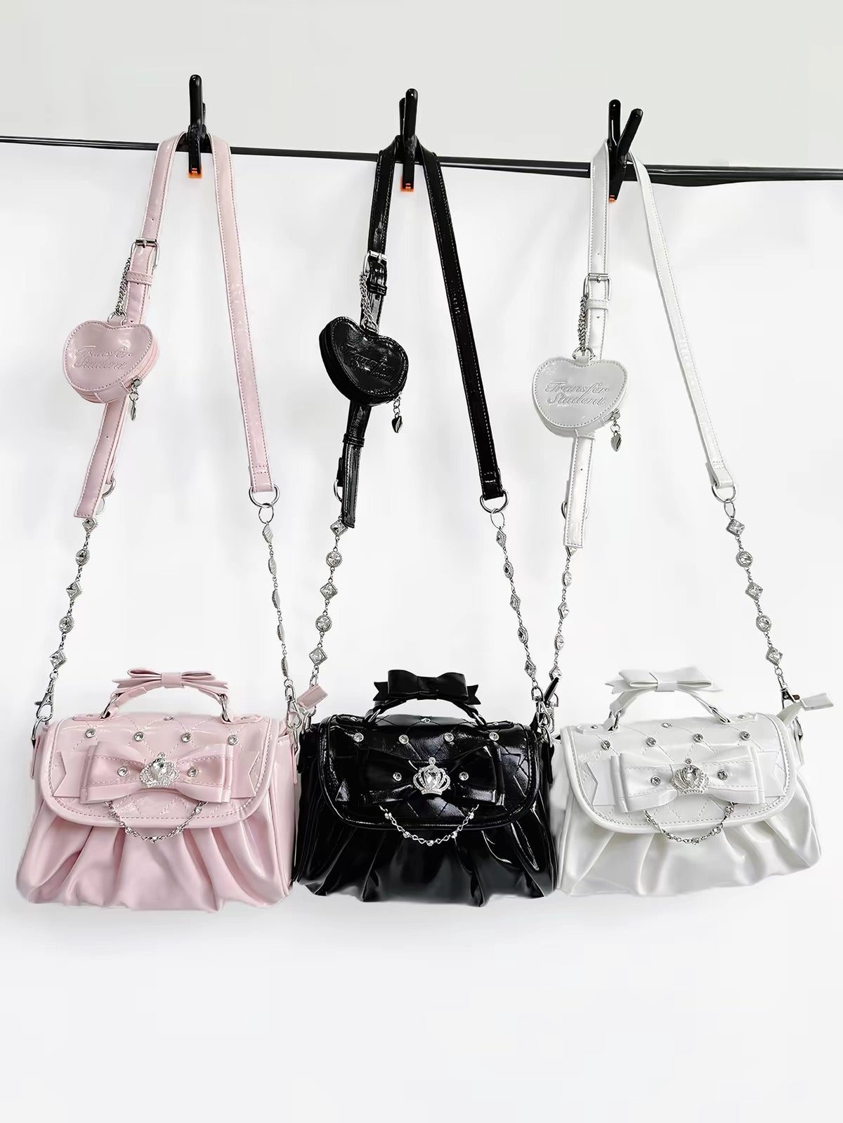 Pink, black, and white bow rhinestone handbags with shoulder straps