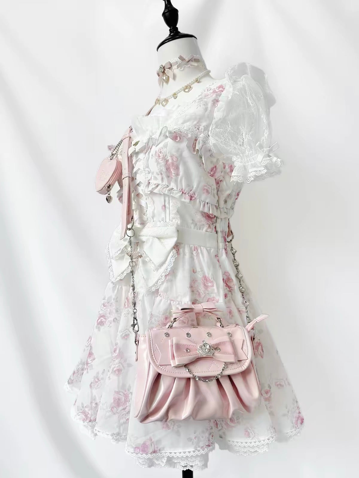 Pink bow rhinestone handbag styled with a floral lace dress