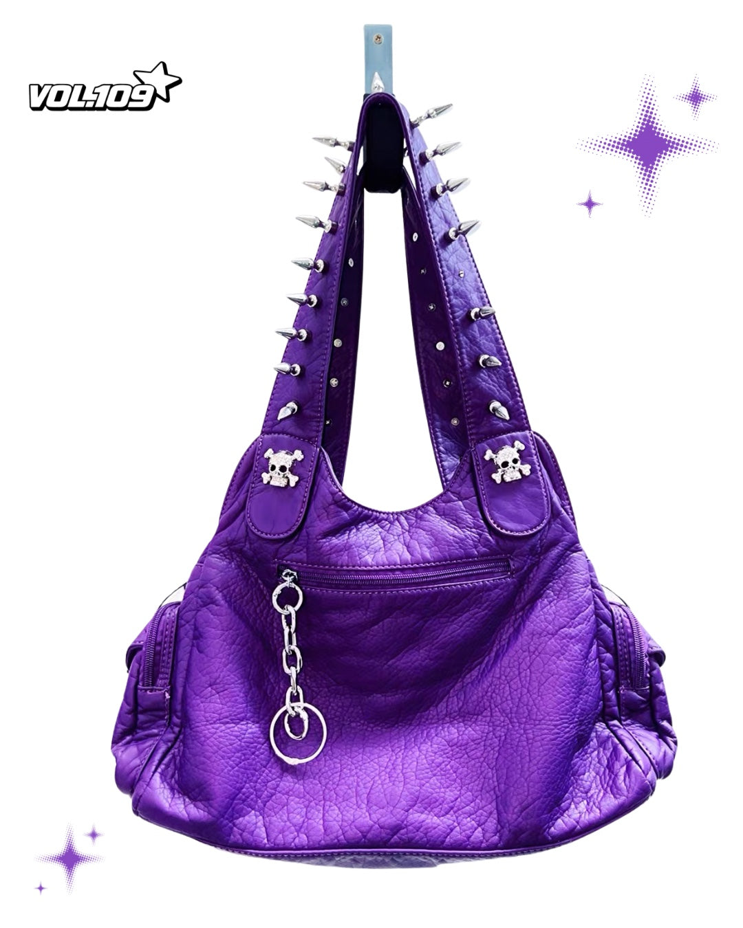 Back view of purple shoulder bag with spike straps and silver-tone hardware