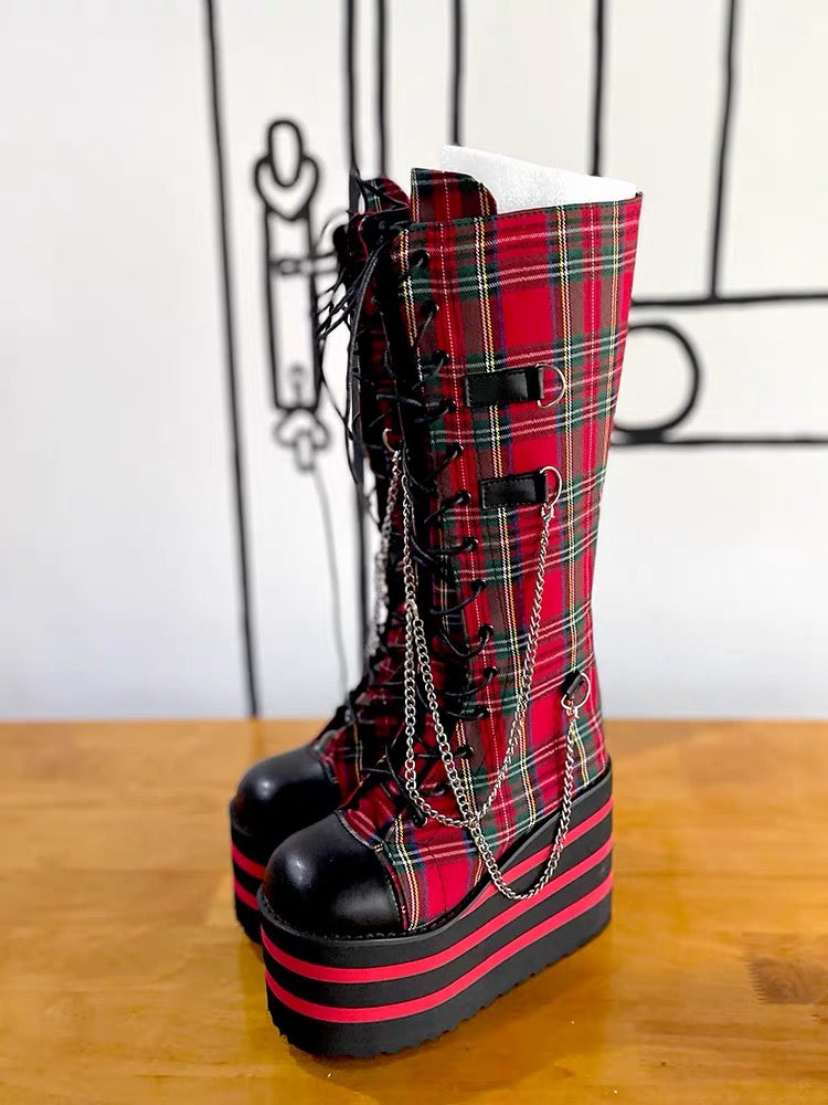 Red plaid knee-high platform boots with chains