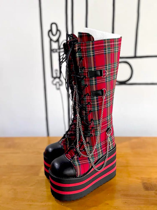 Red plaid knee-high platform boots with chains