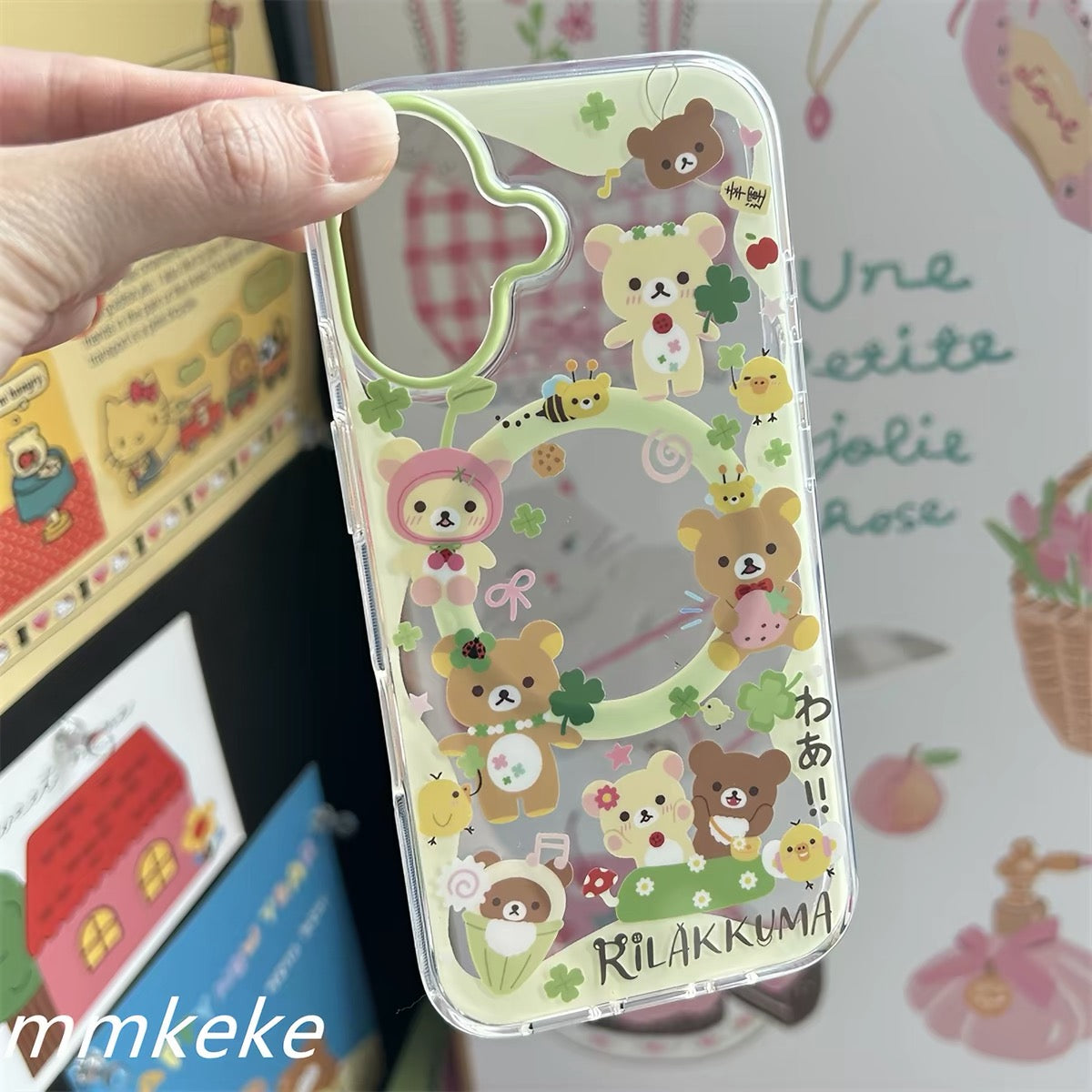 Close-up of Rilakkuma clover phone case and green decorative charm