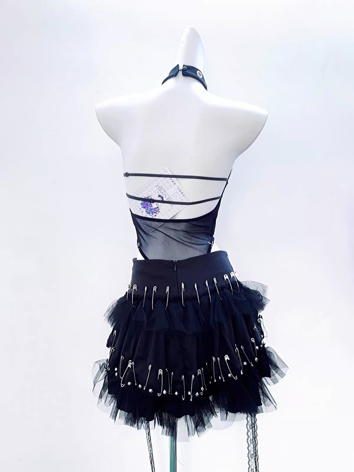 Black safety pin skull top and layered skirt full set back view