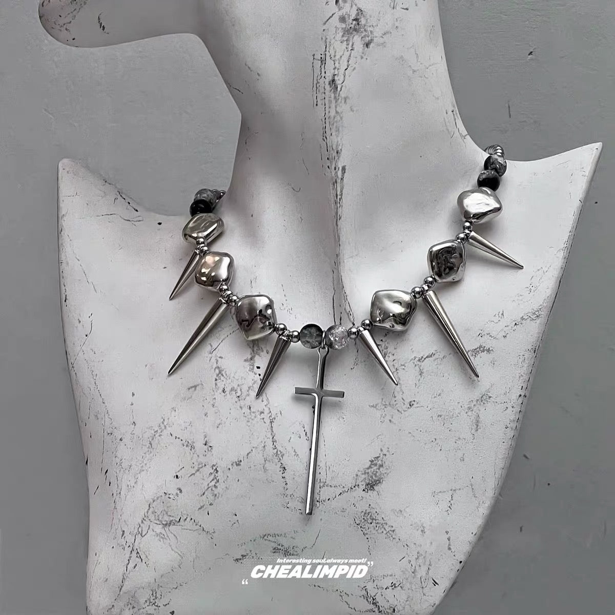 Silver-tone spike and cross necklace front view