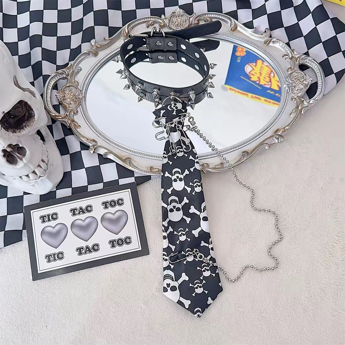Assorted plaid and skull tie variants with matching spiked chokers