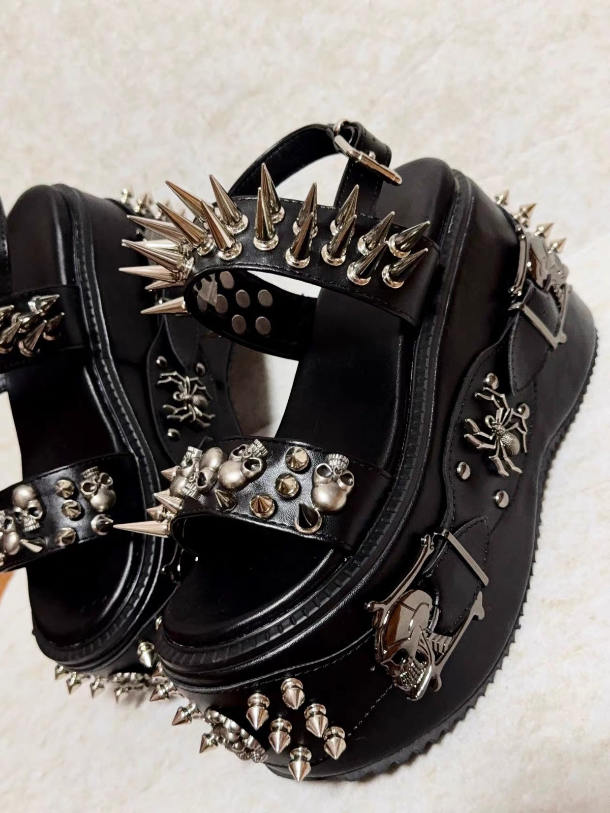Black spiked skull platform sandals with silver hardware