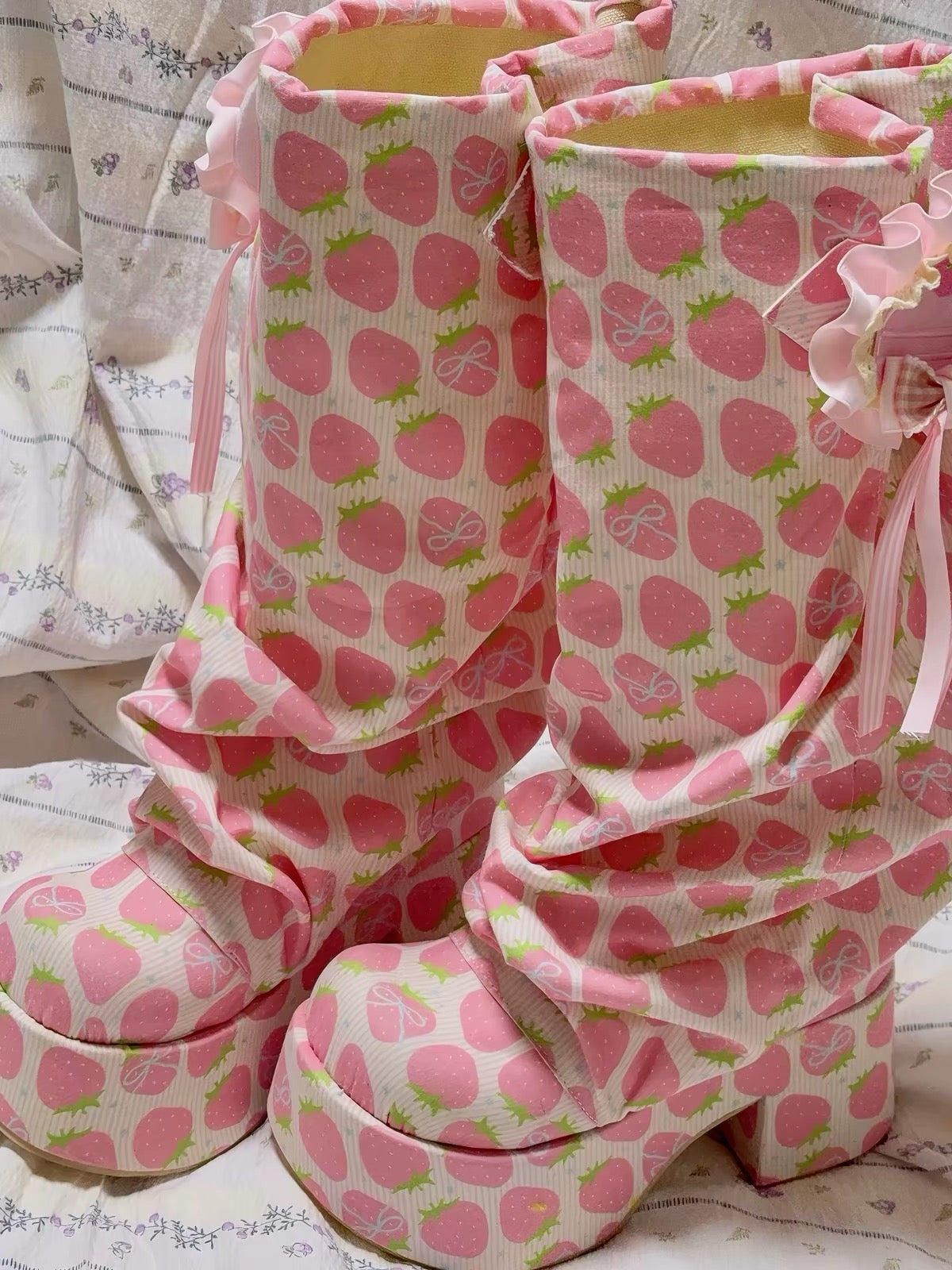 Pink strawberry print slouch platform boots detail