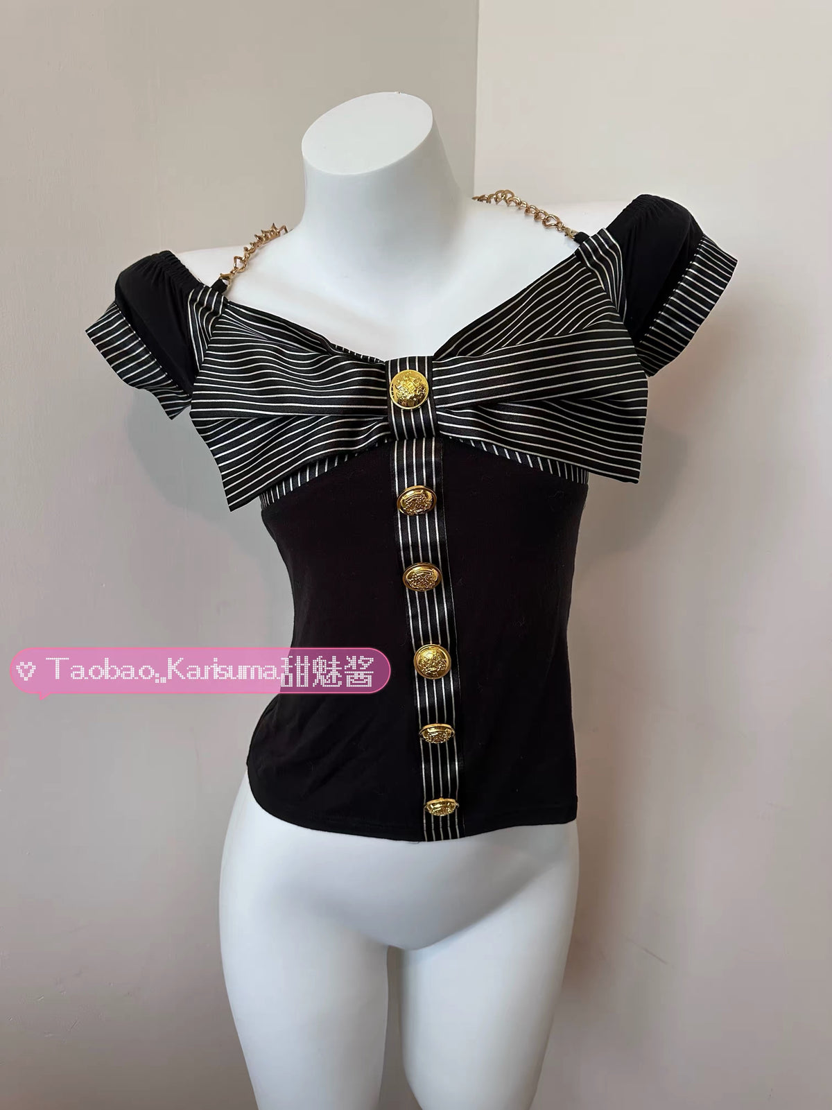 Black fitted GAL top with black striped bow and gold buttons