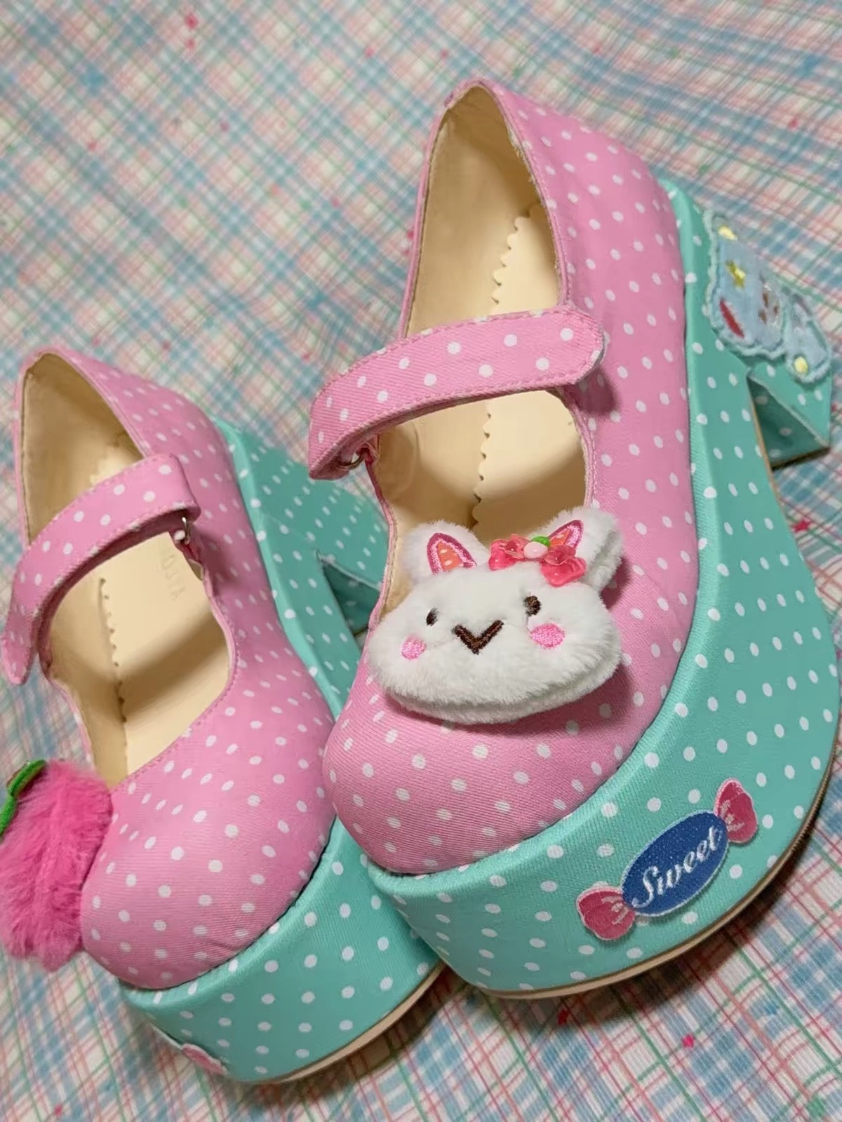 Pink and mint platform Mary Jane shoes photographed on plaid background