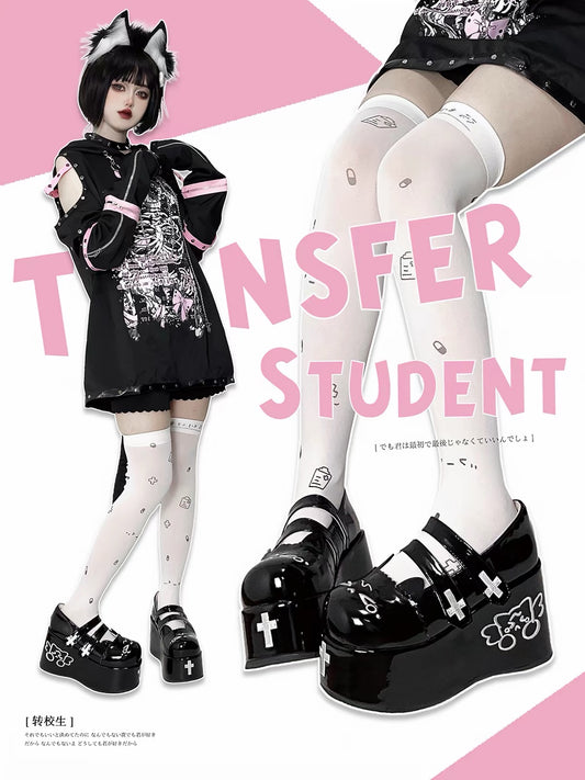 Black platform shoes styled with white tights
