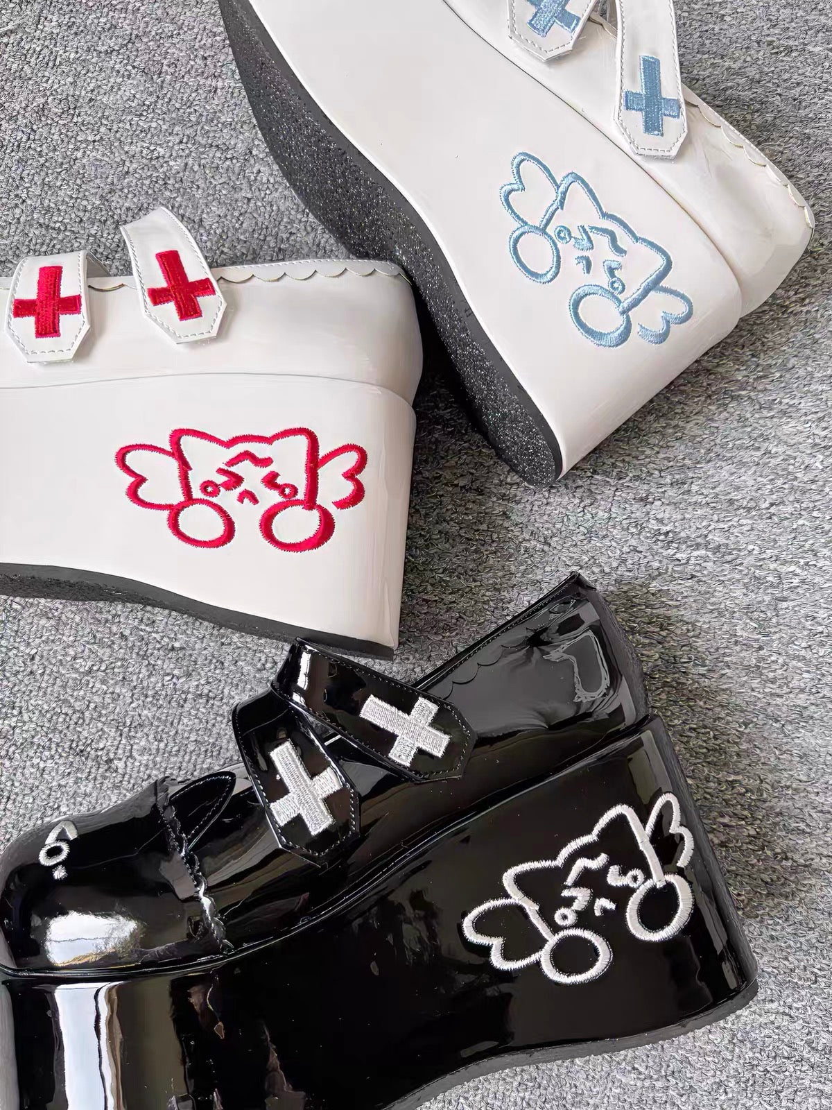 Black and white platform shoes with cross details