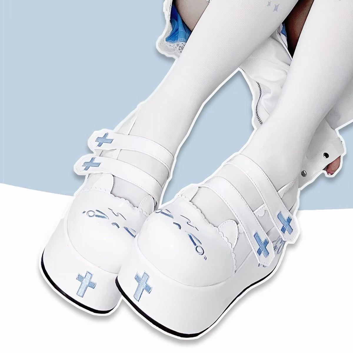 White platform shoes with blue embroidered cross details