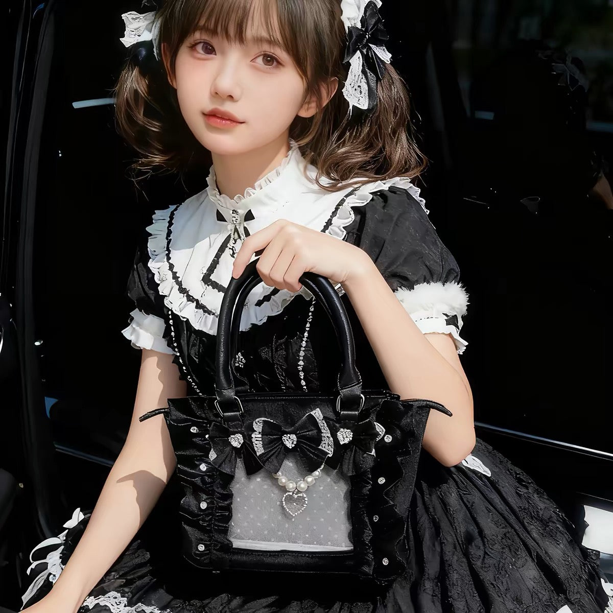 Black velvet bow ita bag modeled with black Lolita outfit