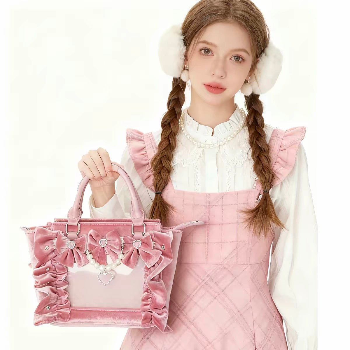 Pink velvet bow ita bag modeled