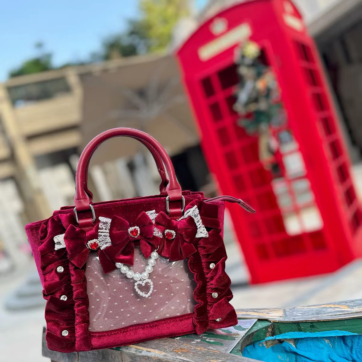 Red velvet bow ita bag with pearl heart details