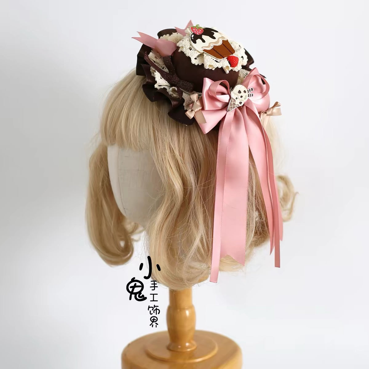 Chocolate and pink dessert headdress worn on blonde wig