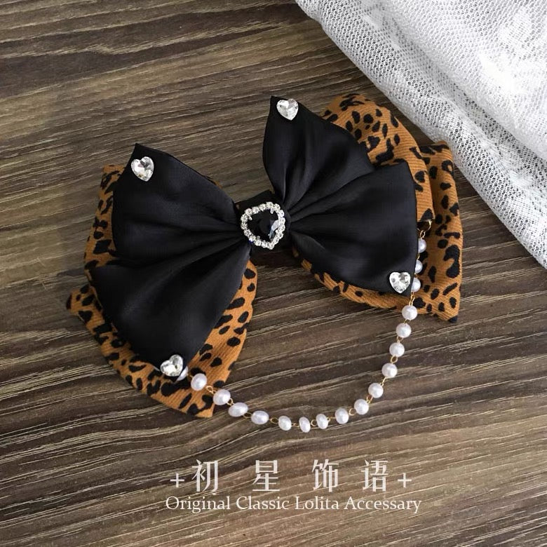 Layered leopard and black bow hair clip with pearl chain and rhinestone heart