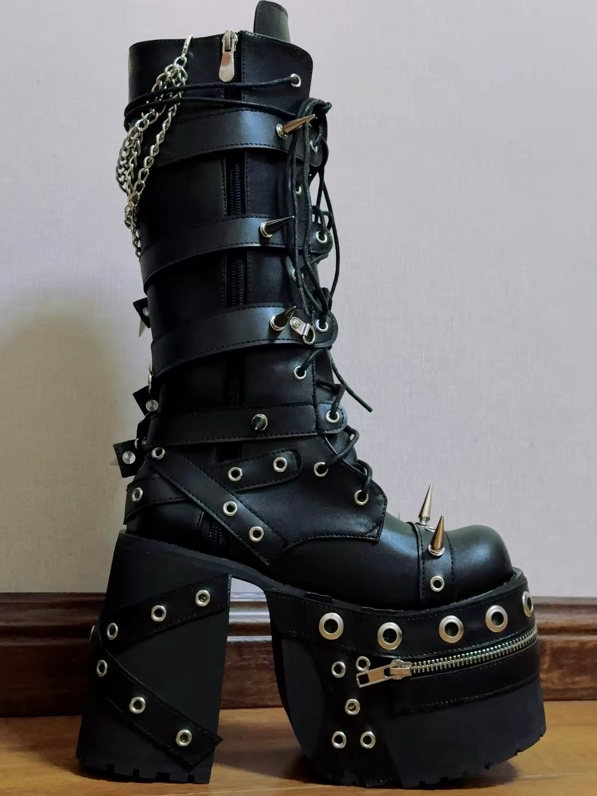Black spiked chain platform boots front detail