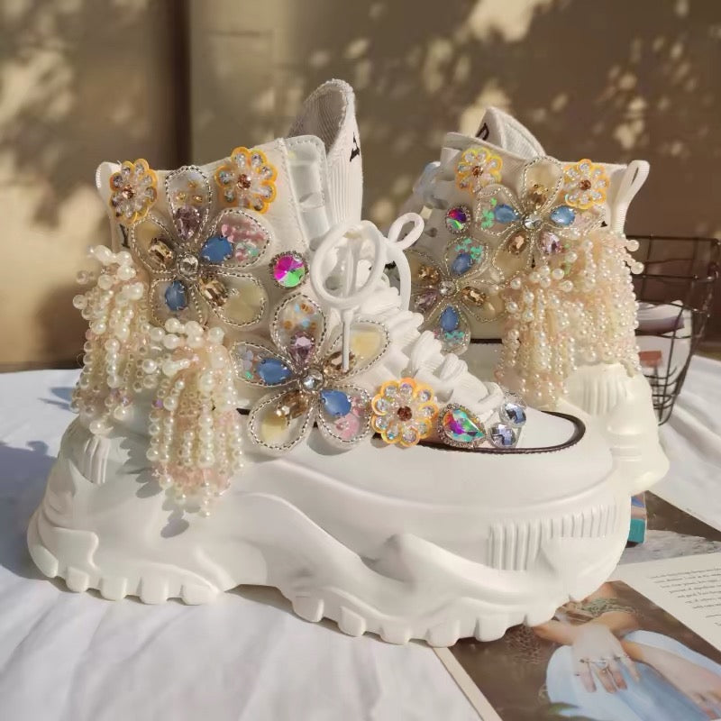White platform shoes with jeweled butterfly appliques and pearl fringe