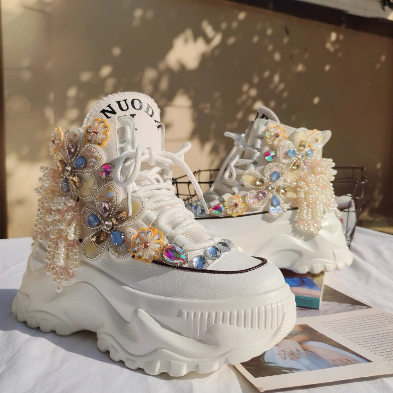 White platform shoes with jeweled floral and butterfly details
