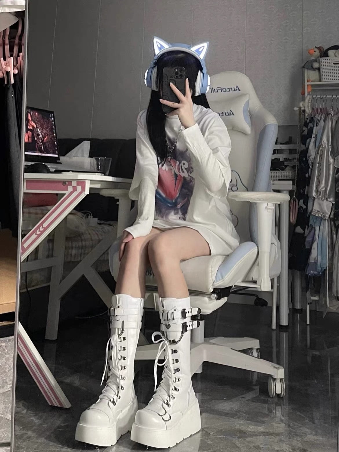White platform knee-high boots worn with casual outfit