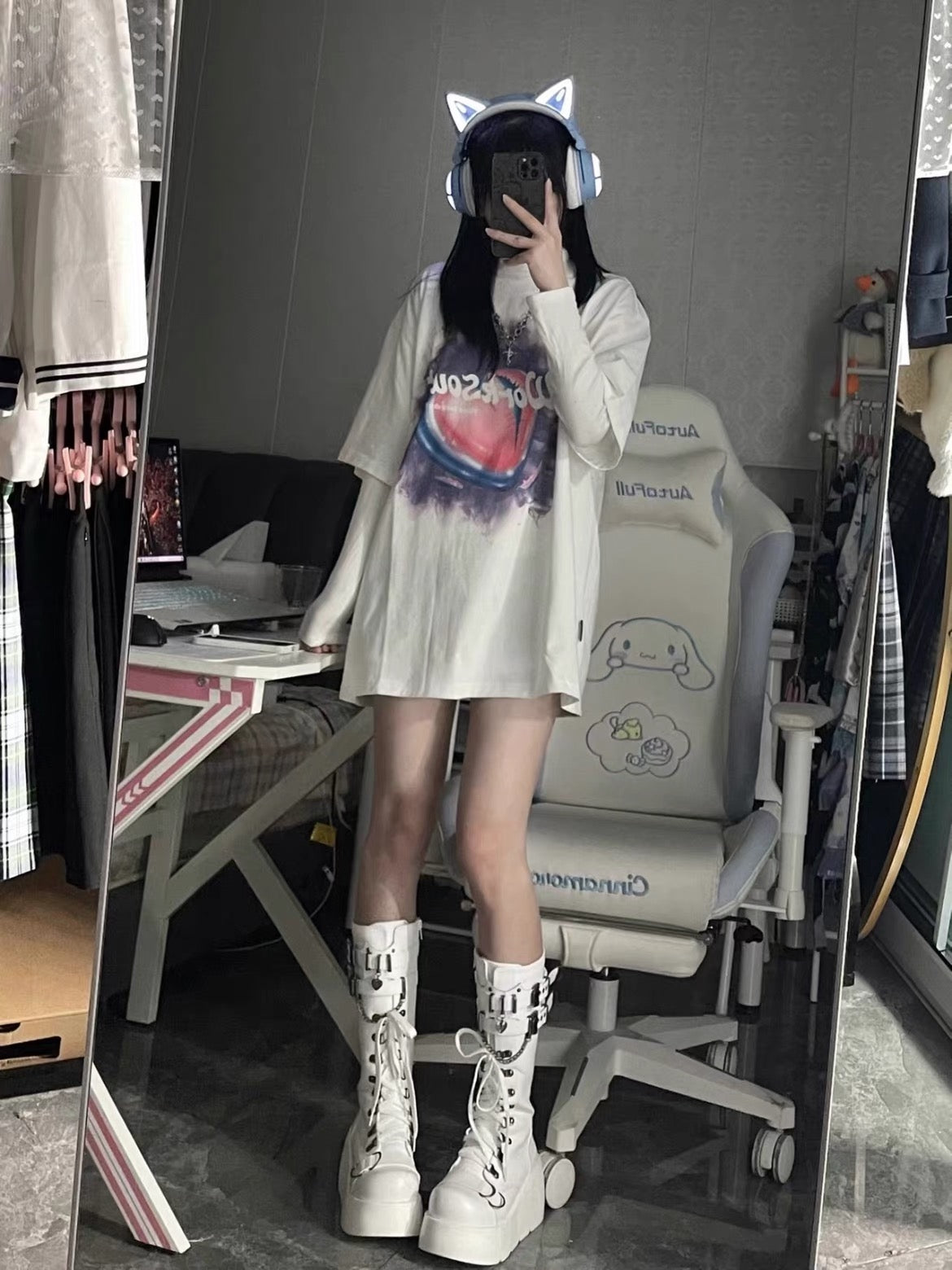 White platform knee-high boots worn in mirror outfit