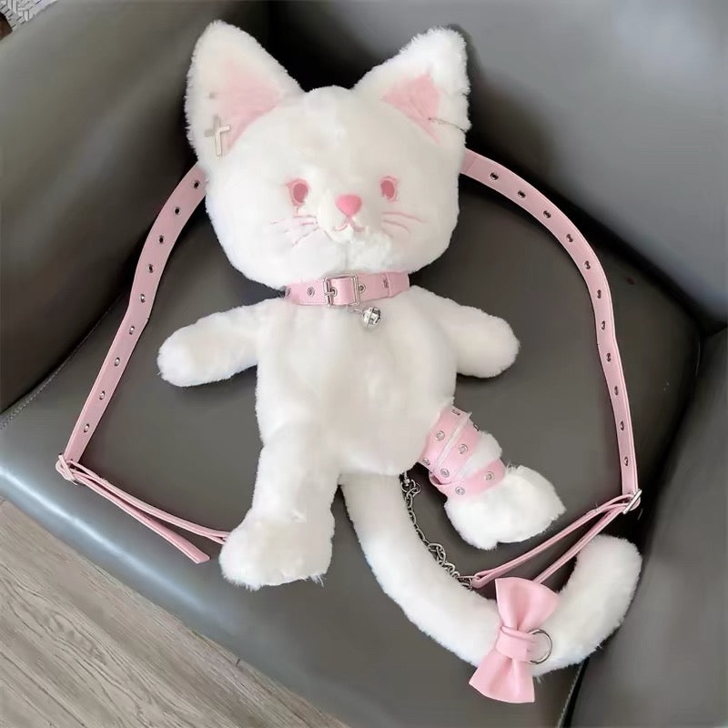 White plush cat crossbody bag styled with pink shoes