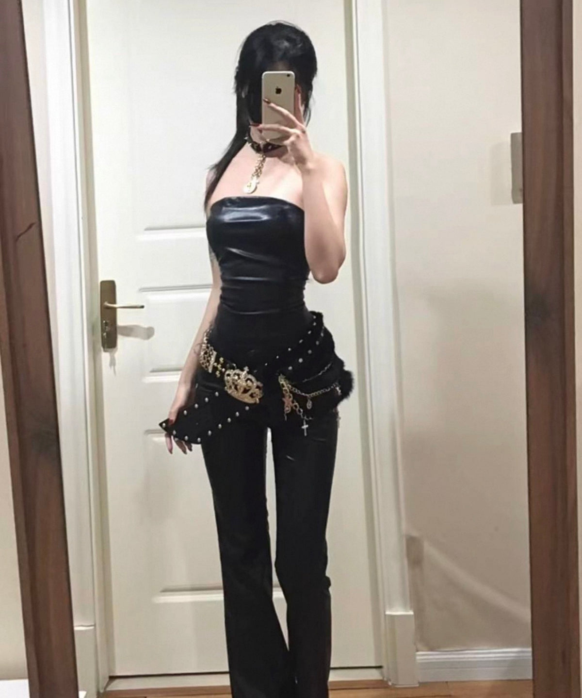 WWWIN gold-tone crown belt with black fur and draped chains styled over a black outfit; clothing not included